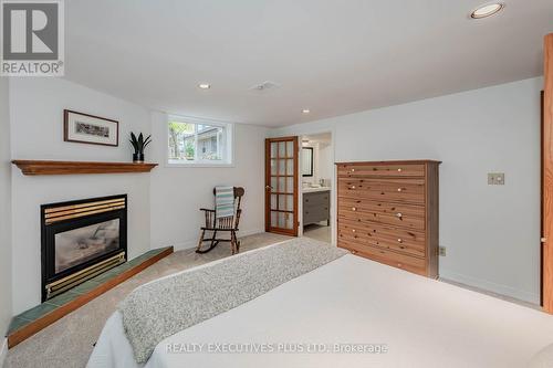 8 Echo Drive, Guelph, ON - Indoor Photo Showing Bedroom With Fireplace