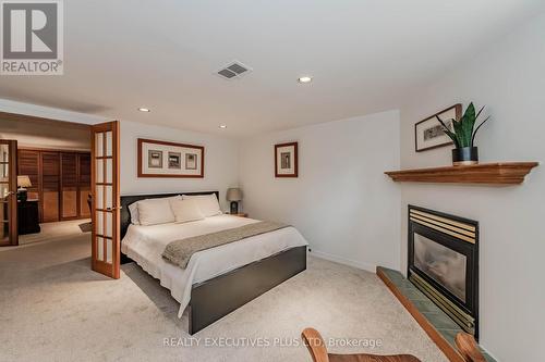 8 Echo Drive, Guelph, ON - Indoor Photo Showing Bedroom With Fireplace