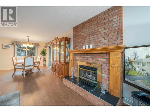 Cozy gas fireplace! - 1251 Ortt Place, Kelowna, BC - Indoor Photo Showing Living Room With Fireplace