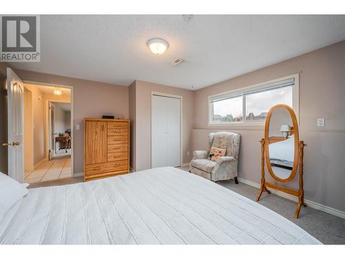 Third bedroom downstairs - 1251 Ortt Place, Kelowna, BC - Indoor Photo Showing Bedroom