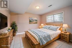 STAGED Fourth bedroom -downstairs *This photo is virtually staged* - 