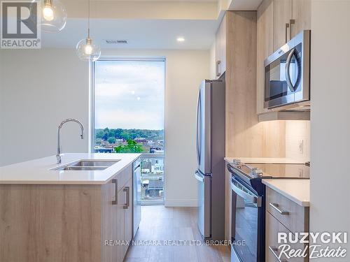 705 - 118 West Street, Port Colborne (Sugarloaf), ON - Indoor Photo Showing Kitchen With Stainless Steel Kitchen With Double Sink