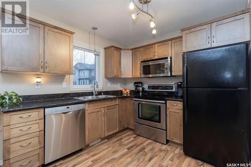 512 303 Slimmon Place, Saskatoon, SK - Indoor Photo Showing Kitchen With Stainless Steel Kitchen With Double Sink