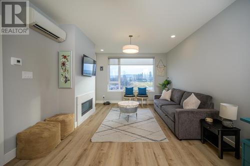 404 1087 6Th Avenue, Prince George, BC - Indoor Photo Showing Living Room With Fireplace