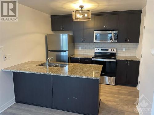 139 Harthill Way Unit#D, Ottawa, ON - Indoor Photo Showing Kitchen With Stainless Steel Kitchen With Double Sink