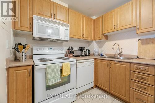 512 - 6720 Glen Erin Drive, Mississauga, ON - Indoor Photo Showing Kitchen With Double Sink