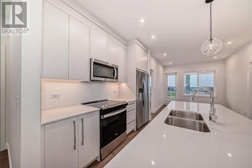 2409, 395 Skyview Parkway Ne, Calgary, AB - Indoor Photo Showing Kitchen With Stainless Steel Kitchen With Double Sink With Upgraded Kitchen