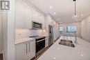 2409, 395 Skyview Parkway Ne, Calgary, AB  - Indoor Photo Showing Kitchen With Stainless Steel Kitchen With Double Sink With Upgraded Kitchen 