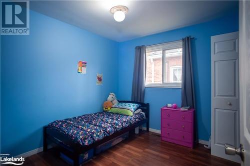 Bedroom featuring dark hardwood / wood-style flooring - 96 Sixth Street, Midland, ON - Indoor Photo Showing Bedroom