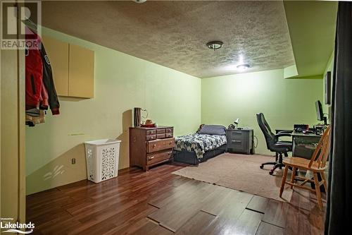 Bedroom with a textured ceiling and dark wood-type flooring - 96 Sixth Street, Midland, ON - Indoor Photo Showing Other Room