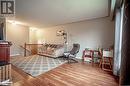 Living room featuring wood-type flooring and a textured ceiling - 96 Sixth Street, Midland, ON  - Indoor 