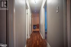 Hall featuring dark hardwood / wood-style flooring - 