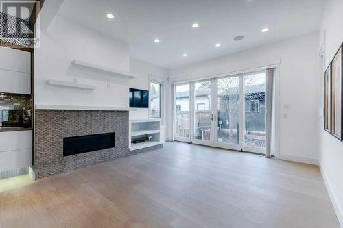 2012 22 Avenue Nw, Calgary, AB - Indoor Photo Showing Living Room With Fireplace