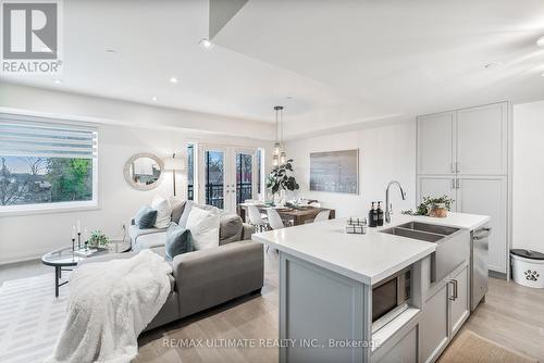 11 - 100 Coxwell Avenue, Toronto, ON - Indoor Photo Showing Kitchen With Double Sink