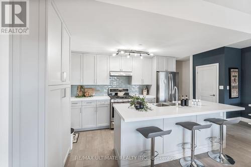 11 - 100 Coxwell Avenue, Toronto, ON - Indoor Photo Showing Kitchen With Double Sink With Upgraded Kitchen