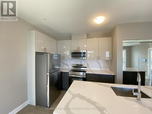 407 - 460 Gordon Krantz Avenue, Milton, ON - Indoor Photo Showing Kitchen With Stainless Steel Kitchen With Double Sink