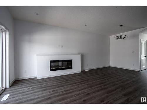 18,22,26 Eden Li, Fort Saskatchewan, AB - Indoor Photo Showing Living Room With Fireplace