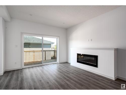 18,22,26 Eden Li, Fort Saskatchewan, AB - Indoor Photo Showing Living Room With Fireplace