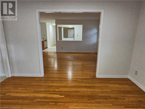 Empty room featuring dark hardwood / wood-style flooring - 551 Hallmark Drive, Waterloo, ON - Indoor Photo Showing Other Room