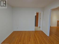 Empty room with light hardwood / wood-style flooring - 