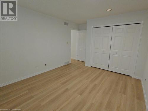 Unfurnished bedroom featuring a closet and light hardwood / wood-style flooring - 551 Hallmark Drive, Waterloo, ON - Indoor Photo Showing Other Room