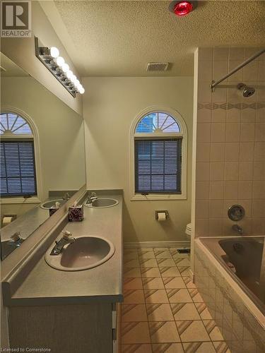 Full bathroom featuring tile patterned flooring, vanity, toilet, and tiled shower / bath - 551 Hallmark Drive, Waterloo, ON - Indoor Photo Showing Bathroom