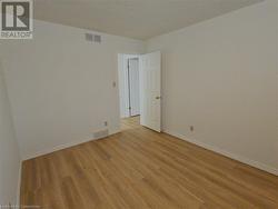 Spare room featuring light hardwood / wood-style floors - 