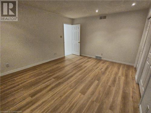 Empty room with dark hardwood / wood-style flooring - 551 Hallmark Drive, Waterloo, ON - Indoor Photo Showing Other Room