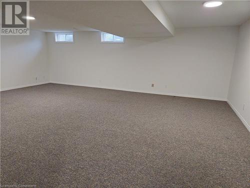 Basement featuring dark colored carpet - 551 Hallmark Drive, Waterloo, ON - Indoor