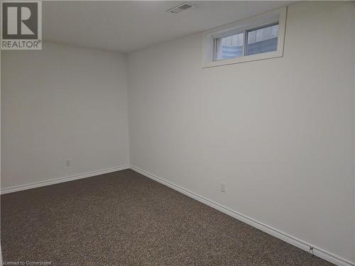 Unfurnished room with carpet floors - 551 Hallmark Drive, Waterloo, ON - Indoor Photo Showing Other Room