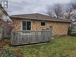 Rear view of house featuring a yard - 