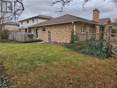 Rear view of house with a lawn and a deck - 551 Hallmark Drive, Waterloo, ON - Outdoor With Deck Patio Veranda