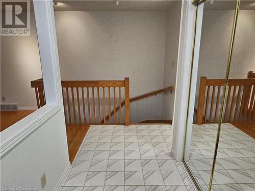 Staircase with hardwood / wood-style flooring - 551 Hallmark Drive, Waterloo, ON - Indoor Photo Showing Other Room