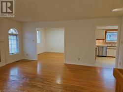 Unfurnished room with sink and light wood-type flooring - 