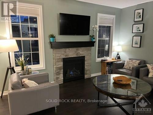 32 Solaris Drive, Ottawa, ON - Indoor Photo Showing Living Room With Fireplace