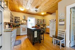 Home's back rental unit kitchen - 