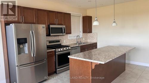 80 Lasby Lane N, Woolwich, ON - Indoor Photo Showing Kitchen With Double Sink