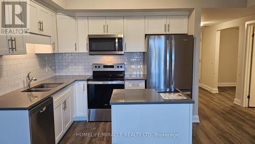 216 - 118 Summersides Boulevard, Pelham, ON - Indoor Photo Showing Kitchen With Double Sink