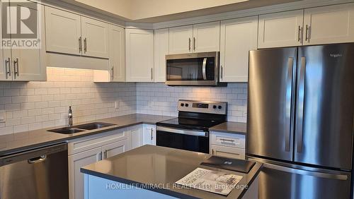 216 - 118 Summersides Boulevard, Pelham, ON - Indoor Photo Showing Kitchen With Double Sink With Upgraded Kitchen