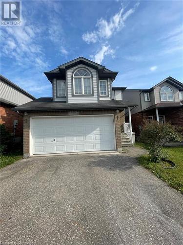 View of front of house with a garage - 126 Peach Blossom Crescent, Kitchener, ON - Outdoor With Facade