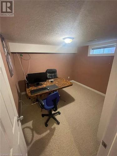 Carpeted office space featuring a textured ceiling - 126 Peach Blossom Crescent, Kitchener, ON - Indoor Photo Showing Office