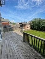 Deck featuring an outdoor structure and a yard - 