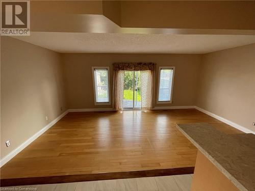 Spare room with light wood-type flooring - 126 Peach Blossom Crescent, Kitchener, ON - Indoor Photo Showing Other Room