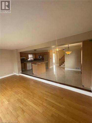 Unfurnished living room with light hardwood / wood-style floors - 126 Peach Blossom Crescent, Kitchener, ON - Indoor Photo Showing Other Room