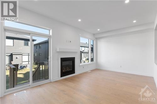 67 Maize Street, Stittsville, ON - Indoor Photo Showing Living Room With Fireplace