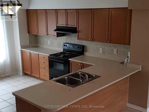 111 - 4950 Winston Churchill Boulevard, Mississauga, ON - Indoor Photo Showing Kitchen With Double Sink