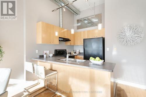 418 - 700 King Street W, Toronto, ON - Indoor Photo Showing Kitchen With Double Sink