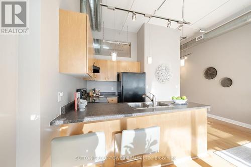 418 - 700 King Street W, Toronto, ON - Indoor Photo Showing Kitchen With Double Sink