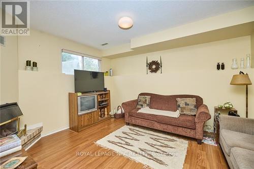 7395 Alex Avenue, Niagara Falls, ON - Indoor Photo Showing Living Room With Fireplace