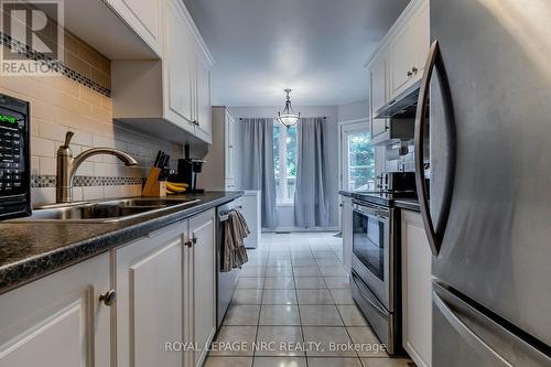 28 - 5070 Drummond Road, Niagara Falls (Cherrywood), ON - Indoor Photo Showing Kitchen With Double Sink